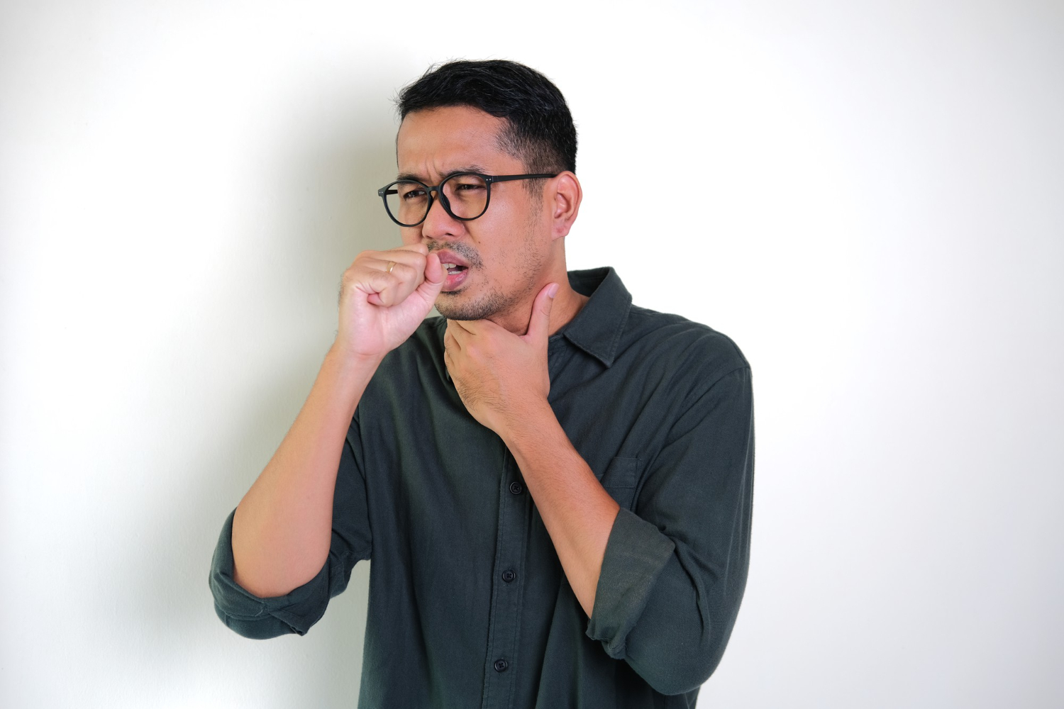 man coughing due to formaldehye in furniture